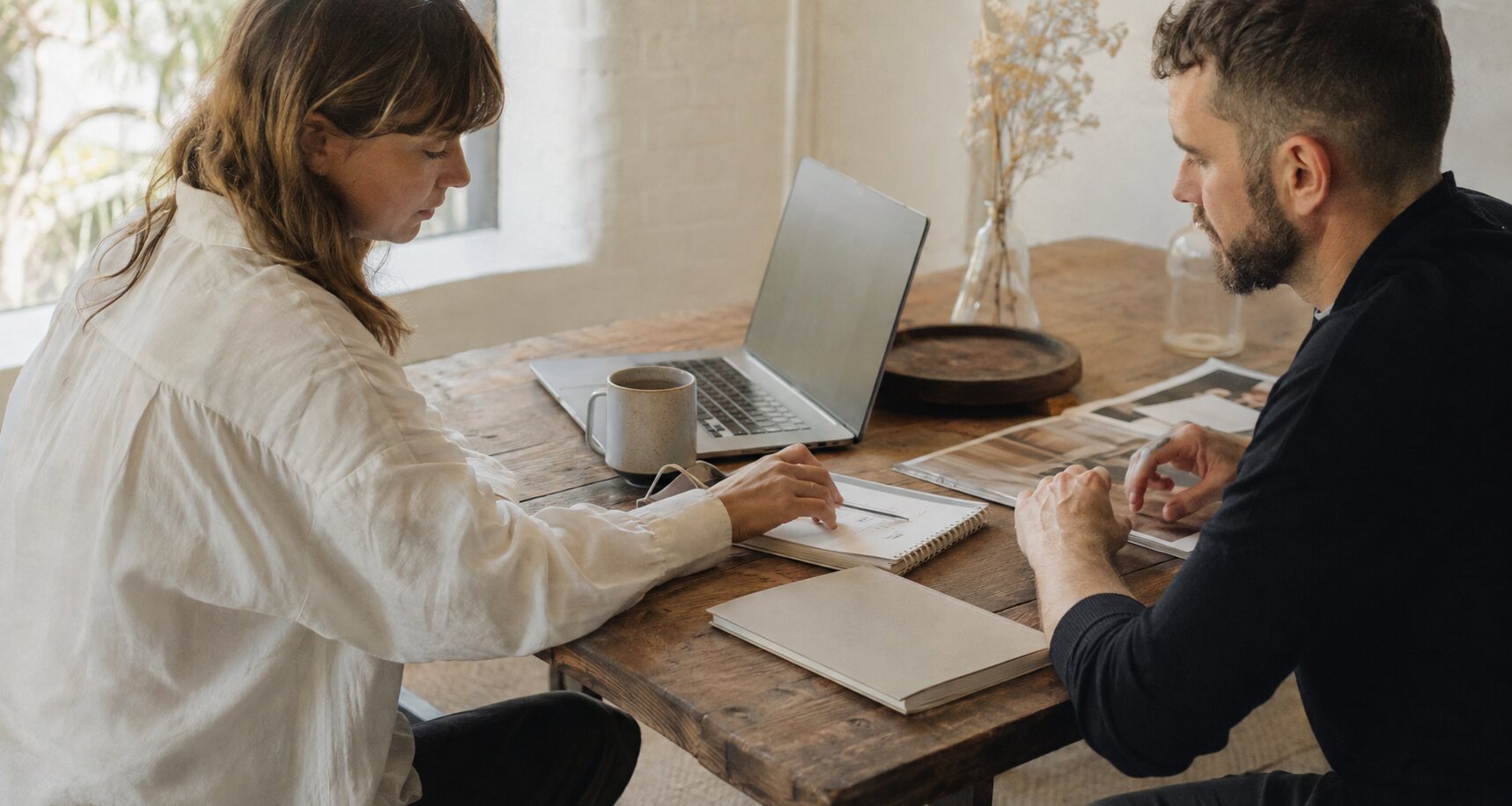 One-to-one marketing consultation at a warm studio table